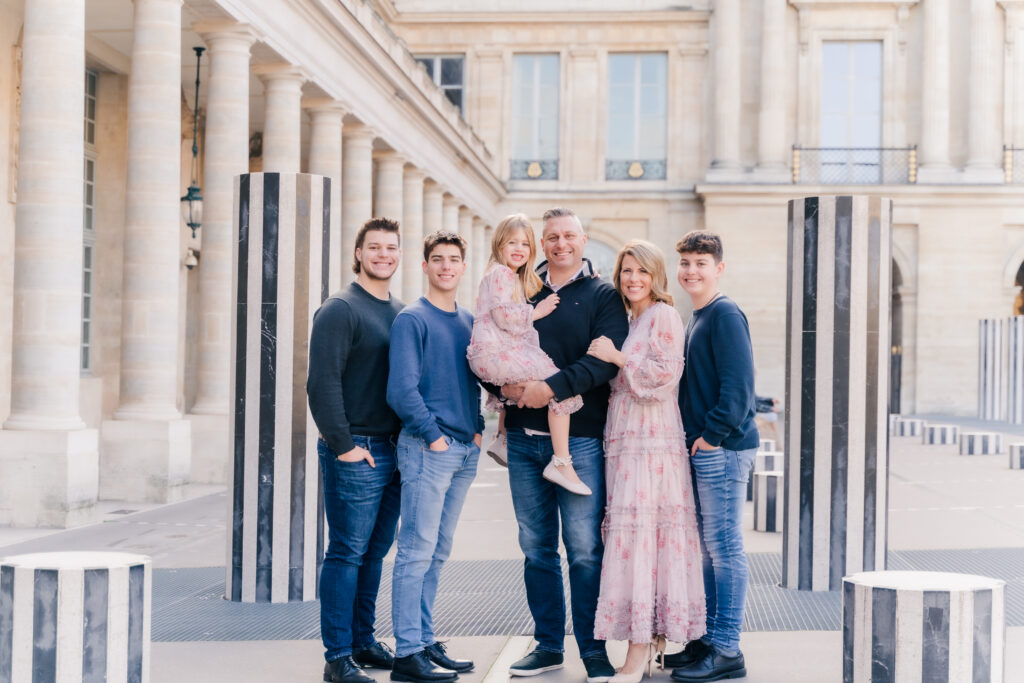 beautiful family in Paris outside of the Louvre museum