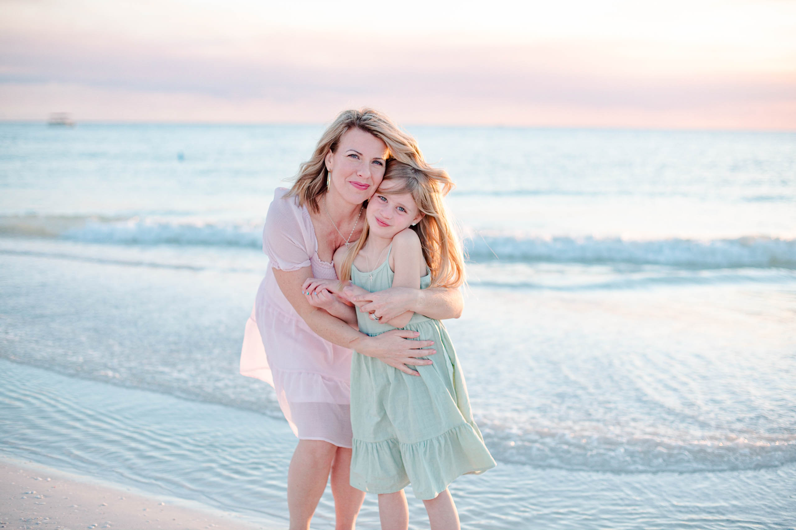 Mother and daughter in beachy dresses enjoying Marco Island Beach, Florida during spring break